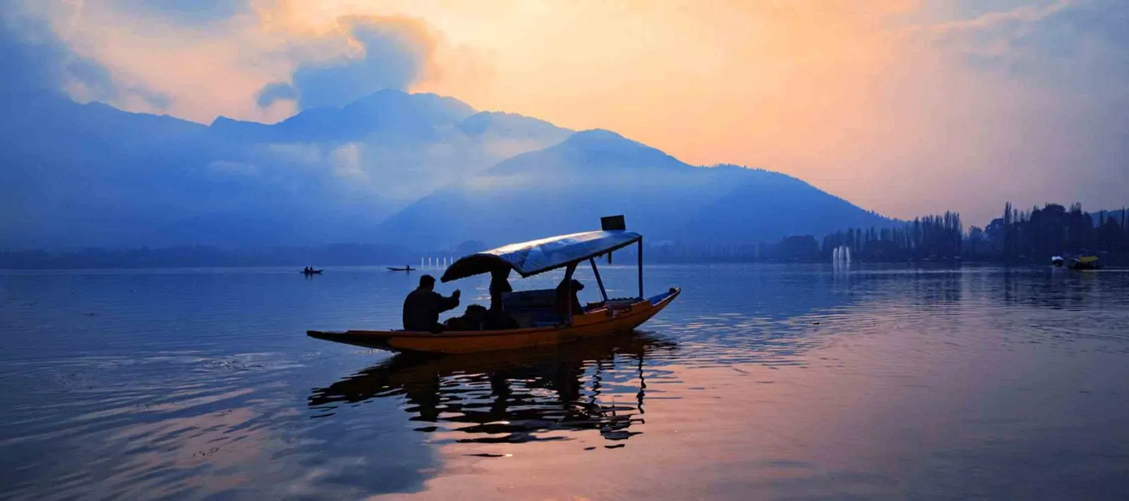 Shikara on Dal Lake, Srinagar, at sunset